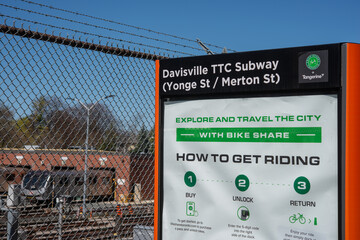 Fototapeta premium Bike Share Toronto station with information poster at Davisville TTC Station (Yonge Street and Merton Street)