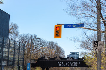 Fototapeta premium general view of rail bridge over Yonge Street (with Kay Gardner Beltline Trail sign) located at Merton Street and Yonge Street in Toronto, Canada