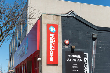 Fototapeta premium exterior signs of Shoppers Drug Mart (1507 Yonge Street) and Tunnel of Glam sign (sculpture, located at 1501 Yonge Street) in Toronto, Canada