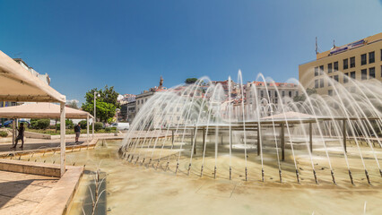 Fountain in Martim Moniz square timelapse hyperlapse in downtown Lisbon