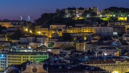 Lisbon aerial cityscape skyline night to day timelapse from viewpoint of St. Peter of Alcantara,...