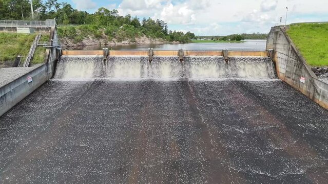 4K, dam water overflow wall, drone approach floodgate wall