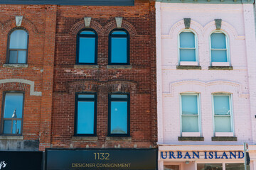 Obraz premium old facades and shops for 1132 Consignment and Urban Island International located on Yonge Street in Toronto, Canada