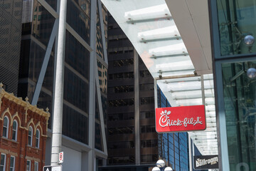 Naklejka premium hanging sign of Chick-fil-A, a conservative American fast food restaurant chain, located at 709 Yonge Street (One Bloor East) in downtown Toronto, Canada