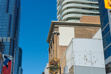 Naklejka premium general view of Elgin & Winter Garden Theatres projecting sign and nearby buildings at 189 Yonge Street in downtown Toronto, Canada