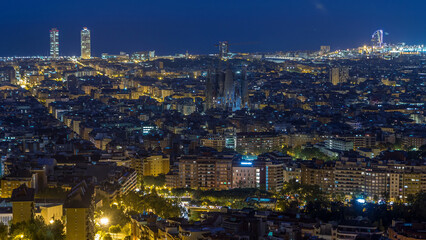 Obraz premium Panorama of Barcelona night to day timelapse, Spain, viewed from the Bunkers of Carmel
