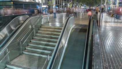 Exit from metro to La Rambla street in Barcelona night timelapse, Spain.