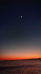 tramonto invernale sul mar ligure con la luna - obrazy, fototapety, plakaty