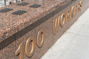 Obraz premium detail of WSIB Simcoe Park Workers Monument 100 Workers located at 200 Front Street West in Toronto, Canada