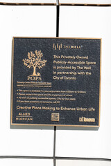 Obraz premium building plaque outside The Well located at 486 Front Street West in Toronto, Canada