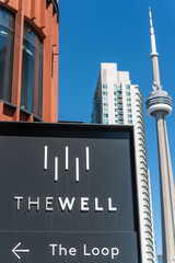Obraz premium general view of the city with sign at The Well, a shopping complex, located at 486 Front Street West in Toronto, Canada (with arrow to The Loop)