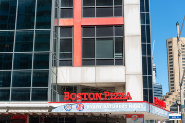 Obraz premium exterior building and sign of Boston Pizza, a pizza restaurant chain, located at 250 Front Street West in Toronto, Canada