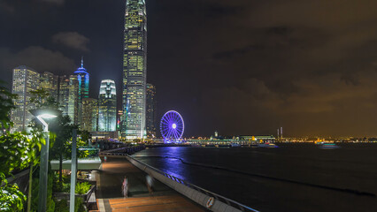 Skyscrapers night timelapse and Hong Kong Observation Wheel, which is the latest tourist attraction...