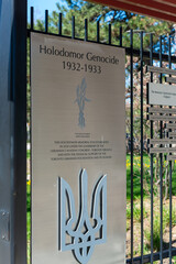 Obraz premium Holodomor Memorial Toronto plaque with inscription located at Canada Boulevard just inside the Princes' Gates