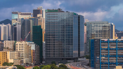 Fototapeta na wymiar Top aerial view of busy traffic day in finance urban timelapse, hong kong city