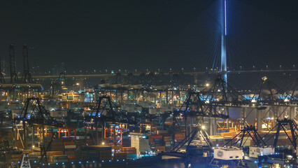 Hong Kong Container Terminal in port at night timelapse