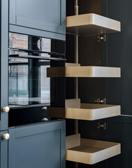 Pull out larder unit in modern gray kitchen