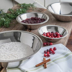 Prep bowls with flour and cranberries for holiday baking
