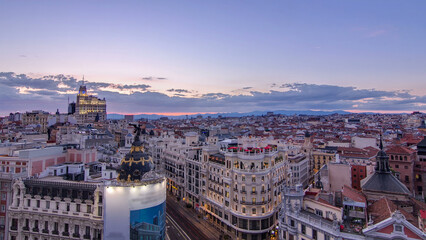 Panoramic aerial view of Gran Via day to night timelapse, Skyline Old Town Cityscape, Metropolis...
