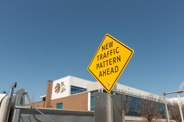 Obraz premium New Traffic Pattern Ahead sign and OVO Athletic Centre, a gym, located at 30 British Columbia Road, Exhibition Place, Toronto, Canada