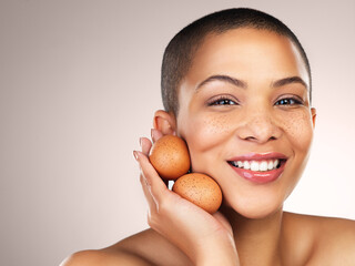 Beauty, hydration and portrait of woman with eggs in studio for natural, cosmetic and facial...