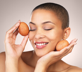 Skincare, happy and woman with eggs in studio for natural, cosmetic and hydration facial treatment....