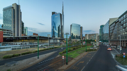 Milan skyline with modern skyscrapers in Porta Nuova business district day to night timelapse in Milan, Italy, after sunset.