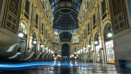 Entrance to the Galleria Vittorio Emanuele II timelapse from Via Tommaso Grossi at night.