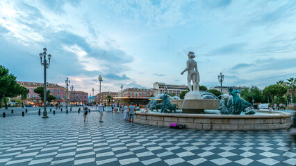 The Fountain du Soleil on Place Massena square Nice day to night timelapse, French Riviera, Cote...