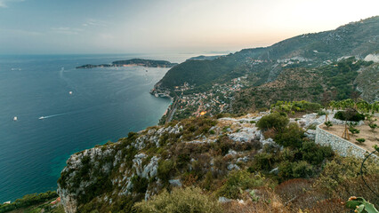 Day to night timelapse view of the Mediterranean coastline of the town of Eze village on the French...