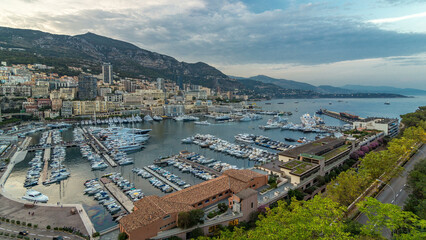 Obraz premium Panorama of Monte Carlo day to night timelapse from the observation deck in the village of Monaco with Port Hercules
