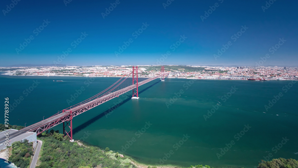 Wall mural 25th of april suspension bridge over the tagus river, connecting almada and lisbon in portugal timel