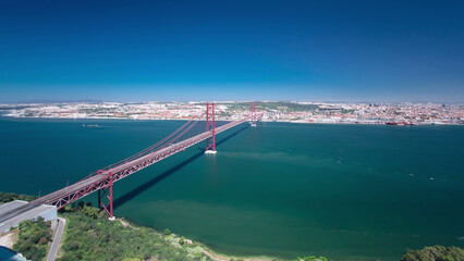 25th of April Suspension Bridge over the Tagus river, connecting Almada and Lisbon in Portugal...