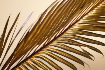 Obraz premium Chic and Stylish: Sophisticated golden palm leaves on a creamy textured background, a symbol of timeless elegance.