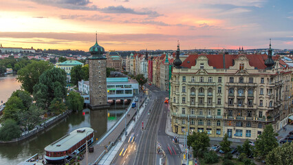 Sitkovska water-tower timelapse and traffic on road in old city center of Prague day to night.