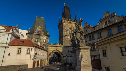 A view along Charles Bridge in Prague towards the Lesser Quarter in the morning timelapse hyperlapse.