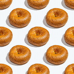 Seamless pattern with bagel on white background.