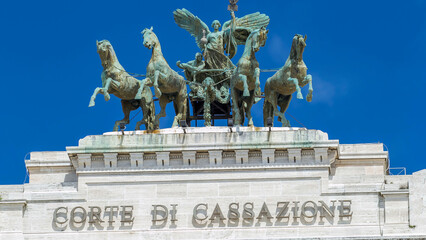 Monument with horses on top of Palace of Justice Palazzo di Giustizia timelapse - obrazy, fototapety, plakaty