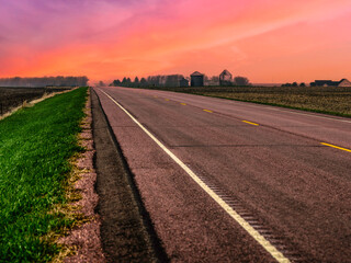 South Dakota Sunset Road Scenery on the rural road running through the agricultural field in...