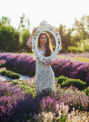  young woman in a blooming lavender field
