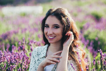 young woman in a blooming lavender field