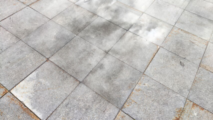 Mist Rises From Urban Pavement Tiles in Early Morning. Background, texture, pattern, copy space,