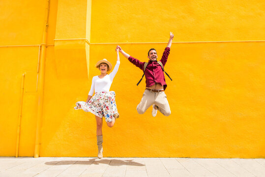 Happy cheerful young ouple travelling in Venice, Italy - Tourists visiting the historic city of Venice