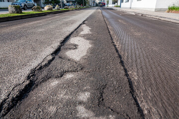 Damaged road prepared by  asphalt milling and grinding scraper machine for road repair. Street...