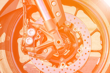 brake disc of a sports motorcycle close-up. Front wheel. The concept of heating during braking