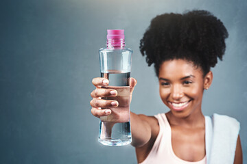 Fitness, bottle and happy woman with water offer in studio for training, workout or hydration...