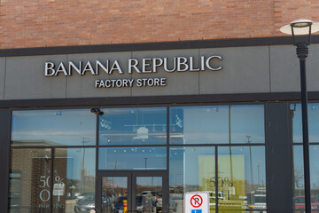 Obraz premium exterior building facade display windows entrance and sign of Banana Republic Factory Store, a clothing store, located here at 1970 St Clair Avenue West in Toronto, Canada (Stock Yards Village)