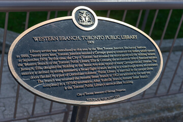 Fototapeta premium close-up of City of Toronto heritage property plaque with inscription (Western Branch, Toronto Public Library today Annette Street Branch) located at 145 Annette Street in The Junction neighborhood