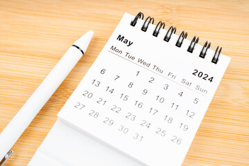 May 2024 Monthly desk calendar for 2024 year with pen.