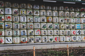 Stack of Traditional Sake Barrels offered in Meiji Jingu Shrine in Tokyo, Japan.